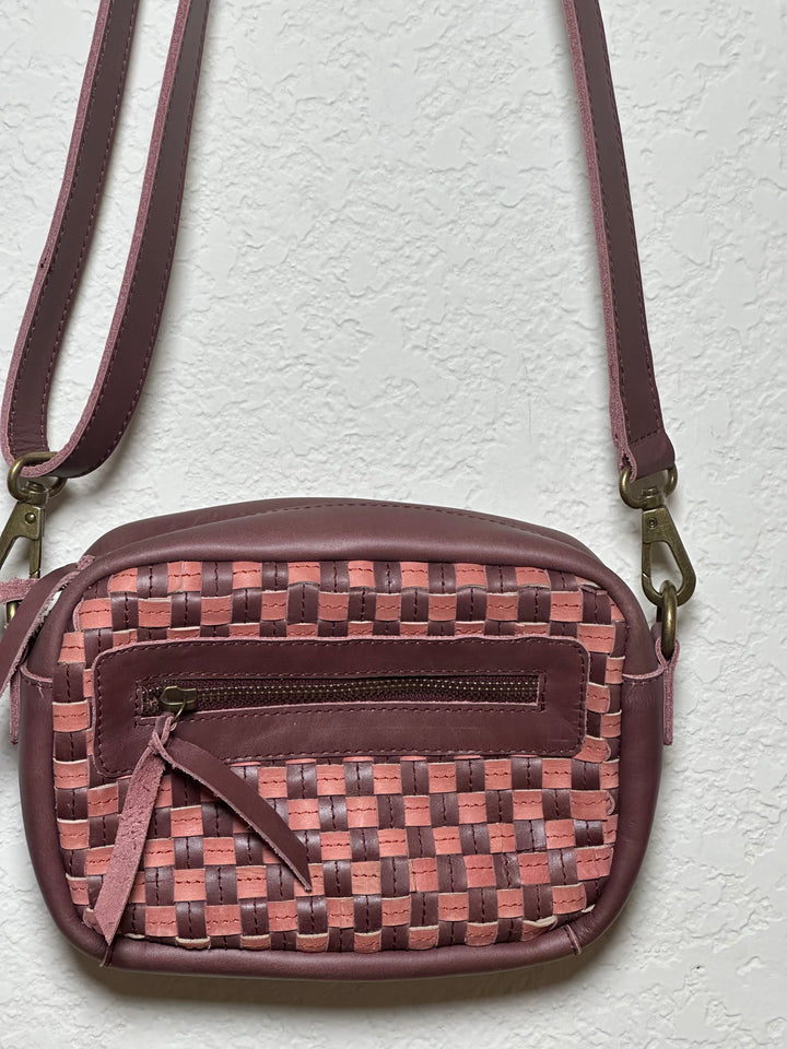 Gode Bag in Garnet Desert Rose — handcrafted Ethiopian leather shoulder bag in plum purple with dusty rose and burgundy undertones, featuring a structured silhouette and zip closure.