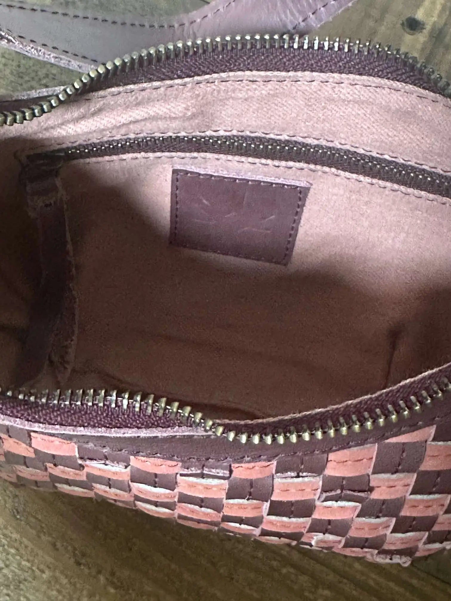 Bella Crescent Shoulder Bag in Garnet Desert Rose — handcrafted in Ethiopia with a handwoven checkered weave in plum purple, dusty rose pink, and deep burgundy upcycled leather- Inside View 