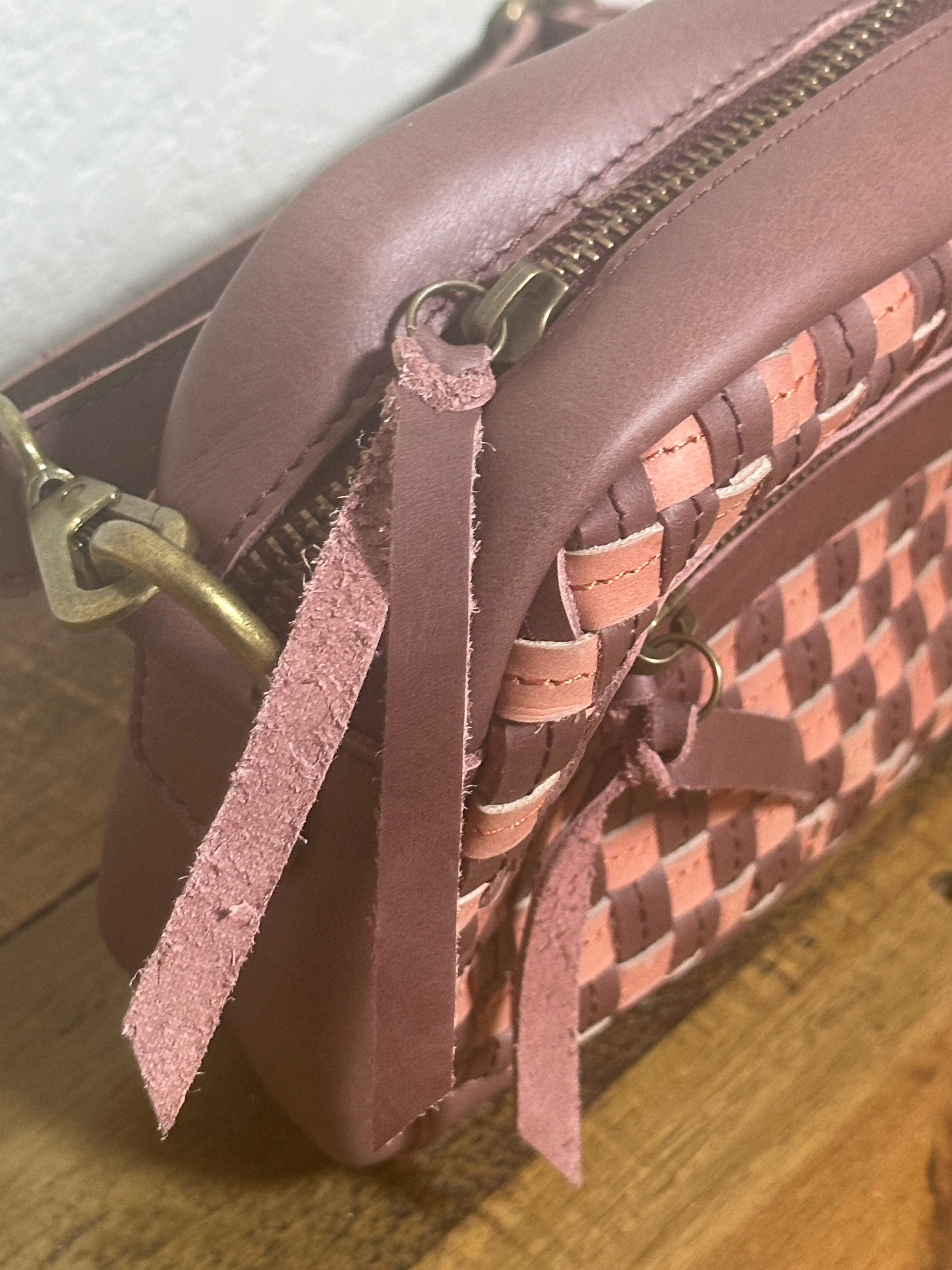 Limited-edition Gode Bag in Garnet Desert Rose, a woven artisan leather bag blending plum purple, dusty rose, and burgundy for a seasonal transitional look.