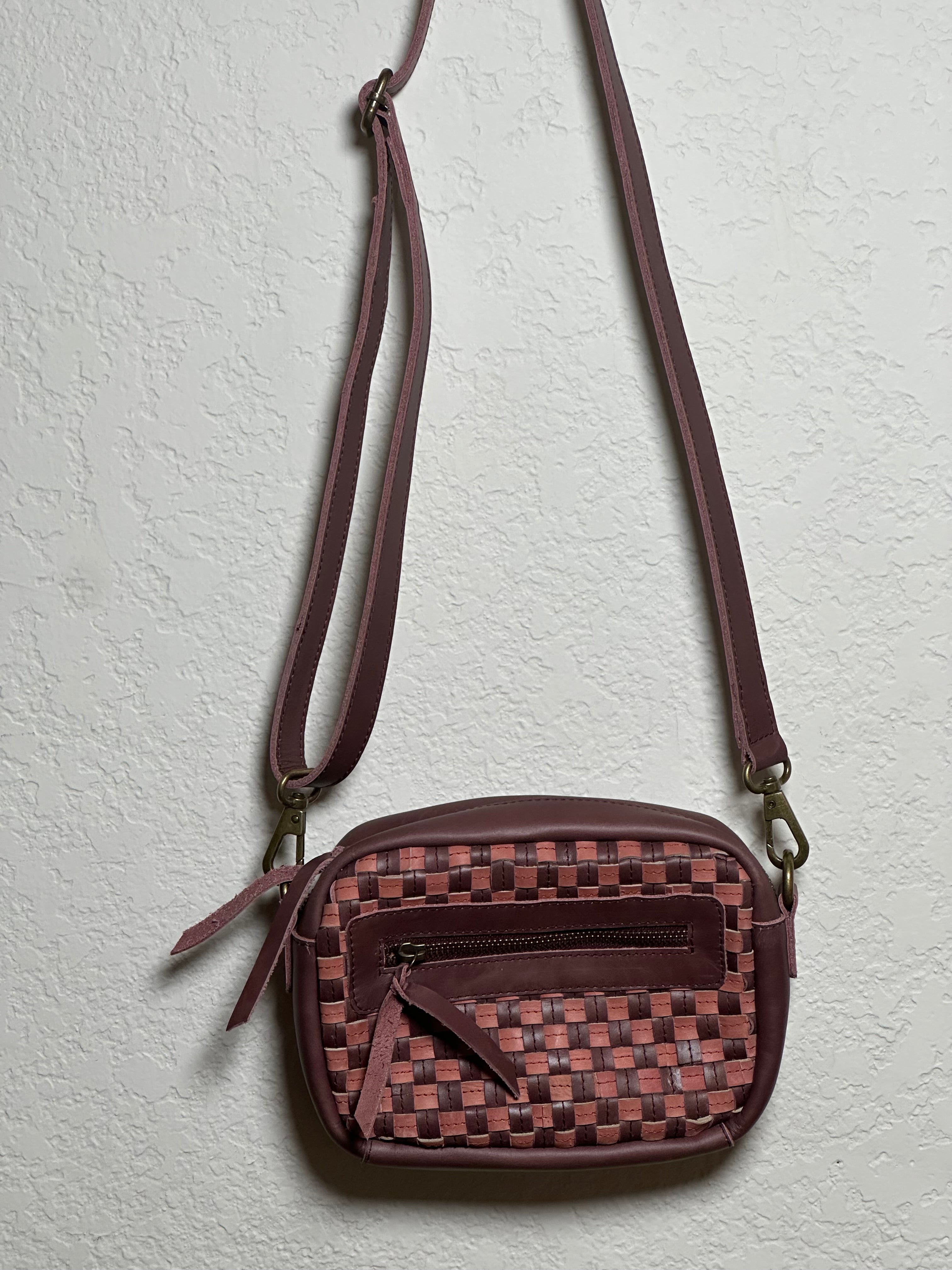Gode Bag in Garnet Desert Rose — artisan-made upcycled leather bag with handwoven checkered pattern in plum purple, dusty rose pink, and deep burgundy tones.