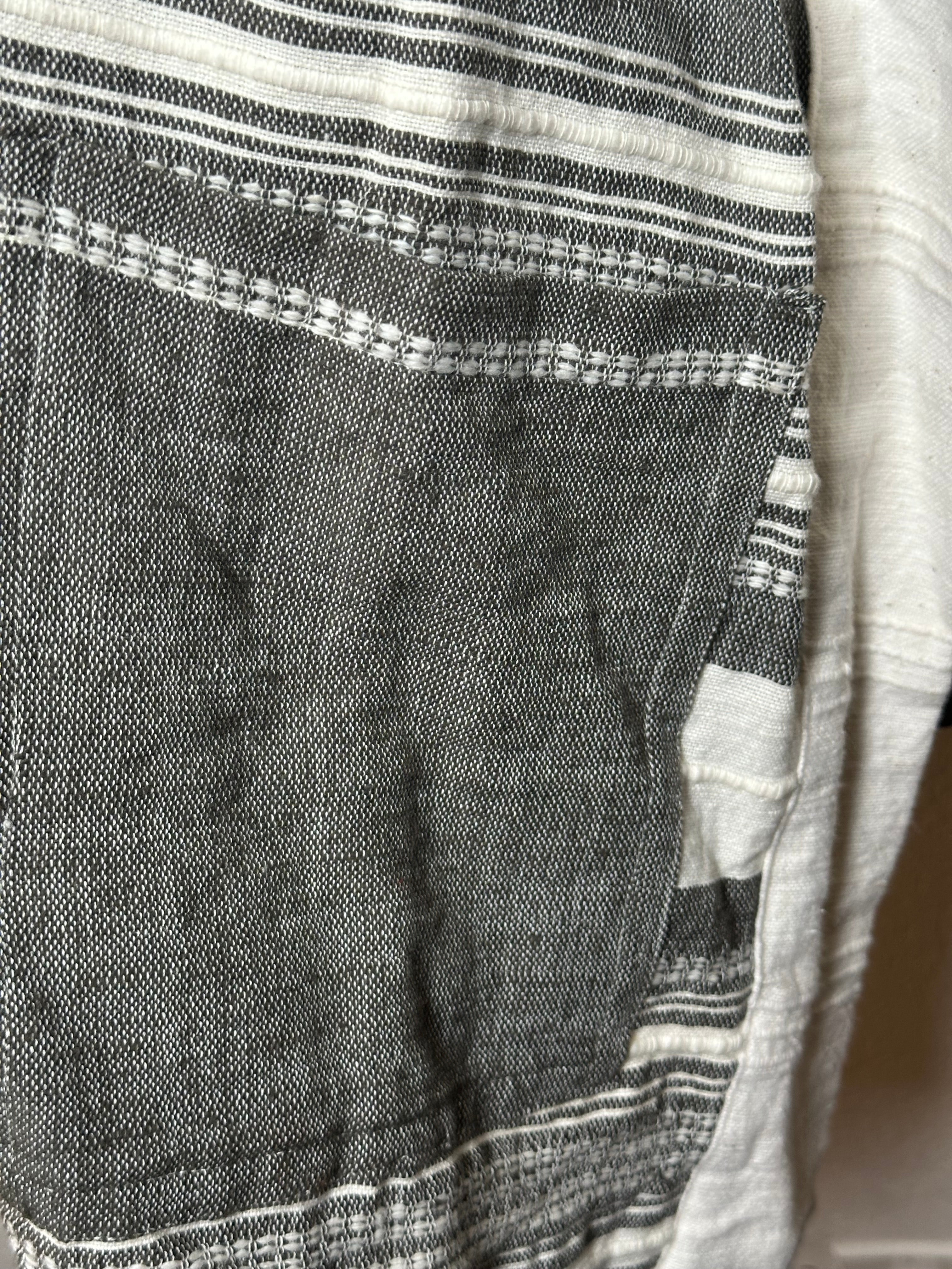 Close-up of a textured fabric with a striped pattern