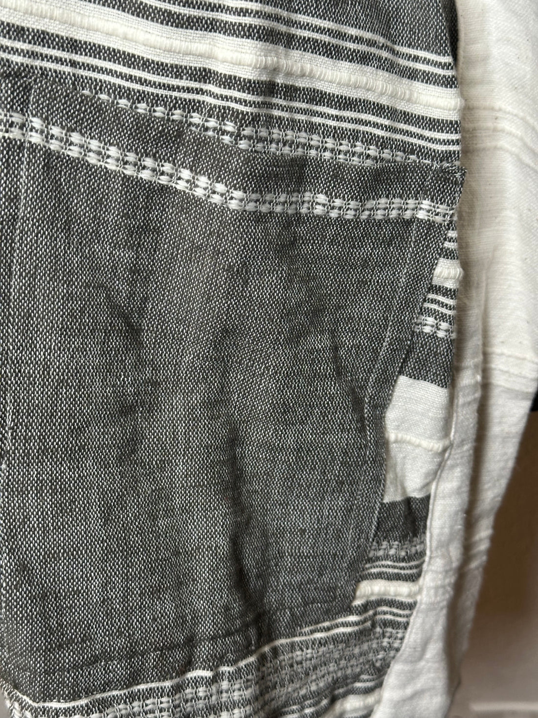Close-up of a textured fabric with a striped pattern