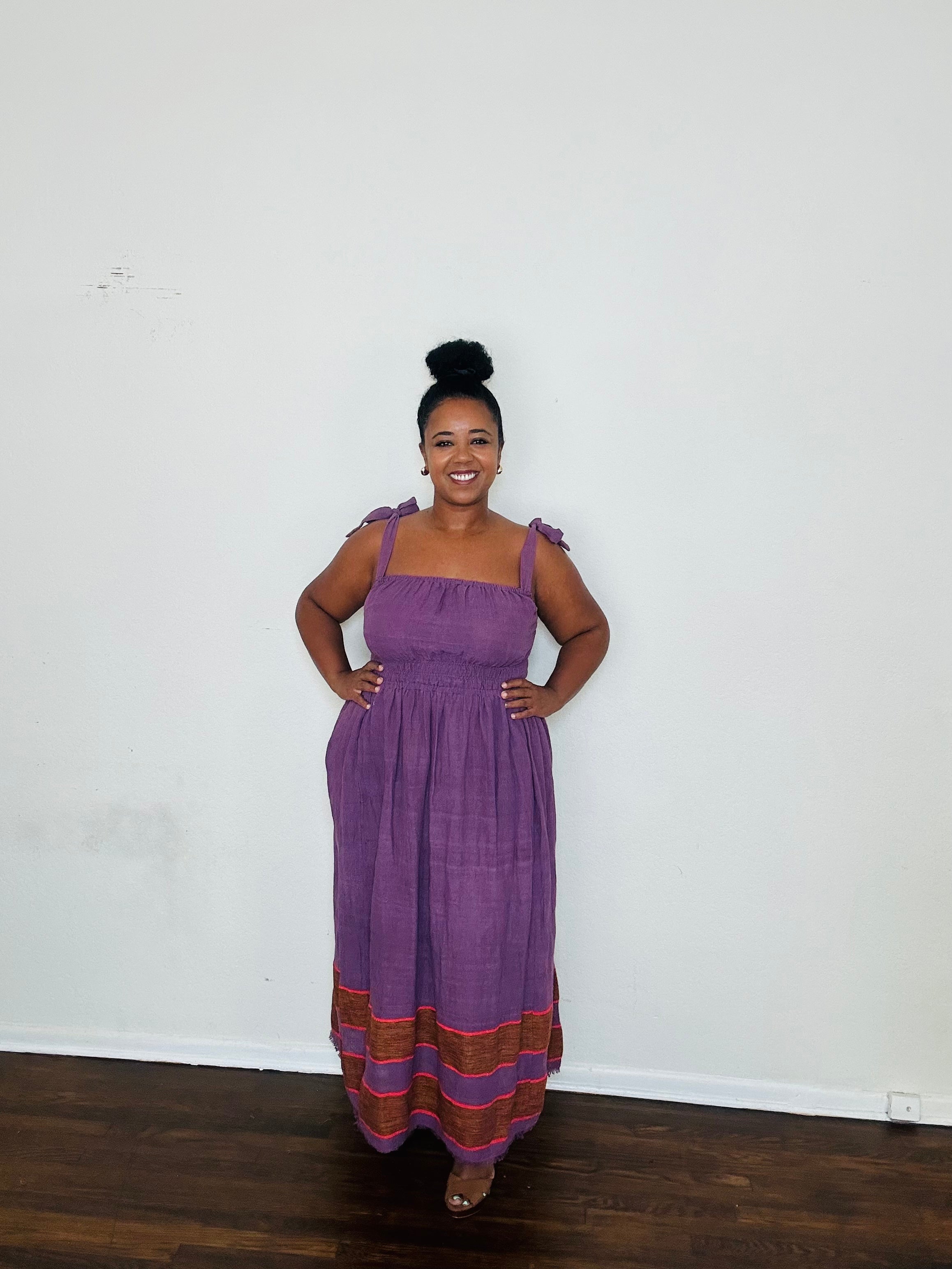 Rawhi Dress Royal Fig — handmade 100% cotton maxi dress with straight neckline, adjustable straps, cinched waist, and flowing A-line silhouette in a rich fig-purple tone, complete with pockets.