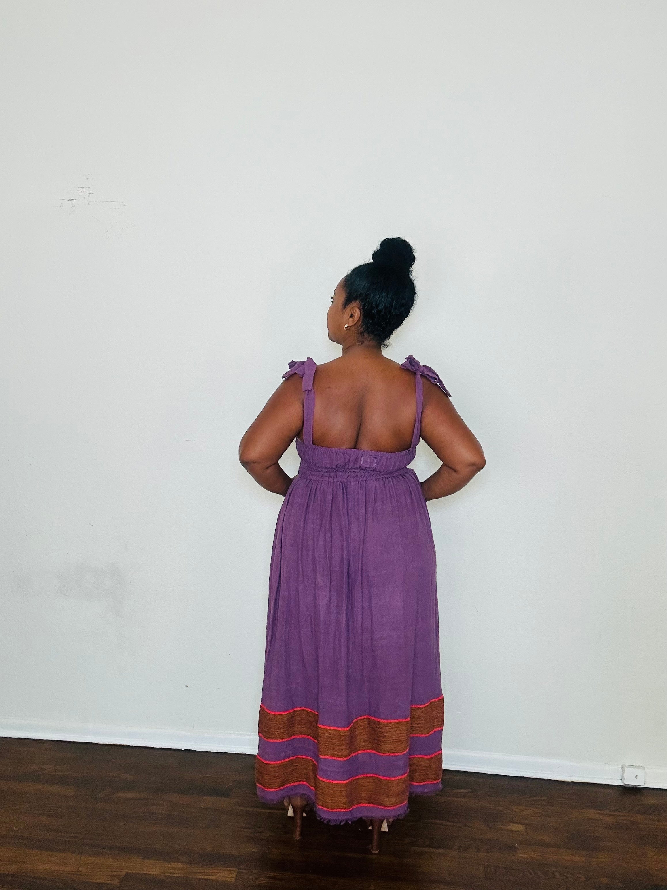 Rawhi Dress Royal Fig — handmade 100% cotton maxi dress with straight neckline, adjustable straps, cinched waist, and flowing A-line silhouette in a rich fig-purple tone, complete with pockets.