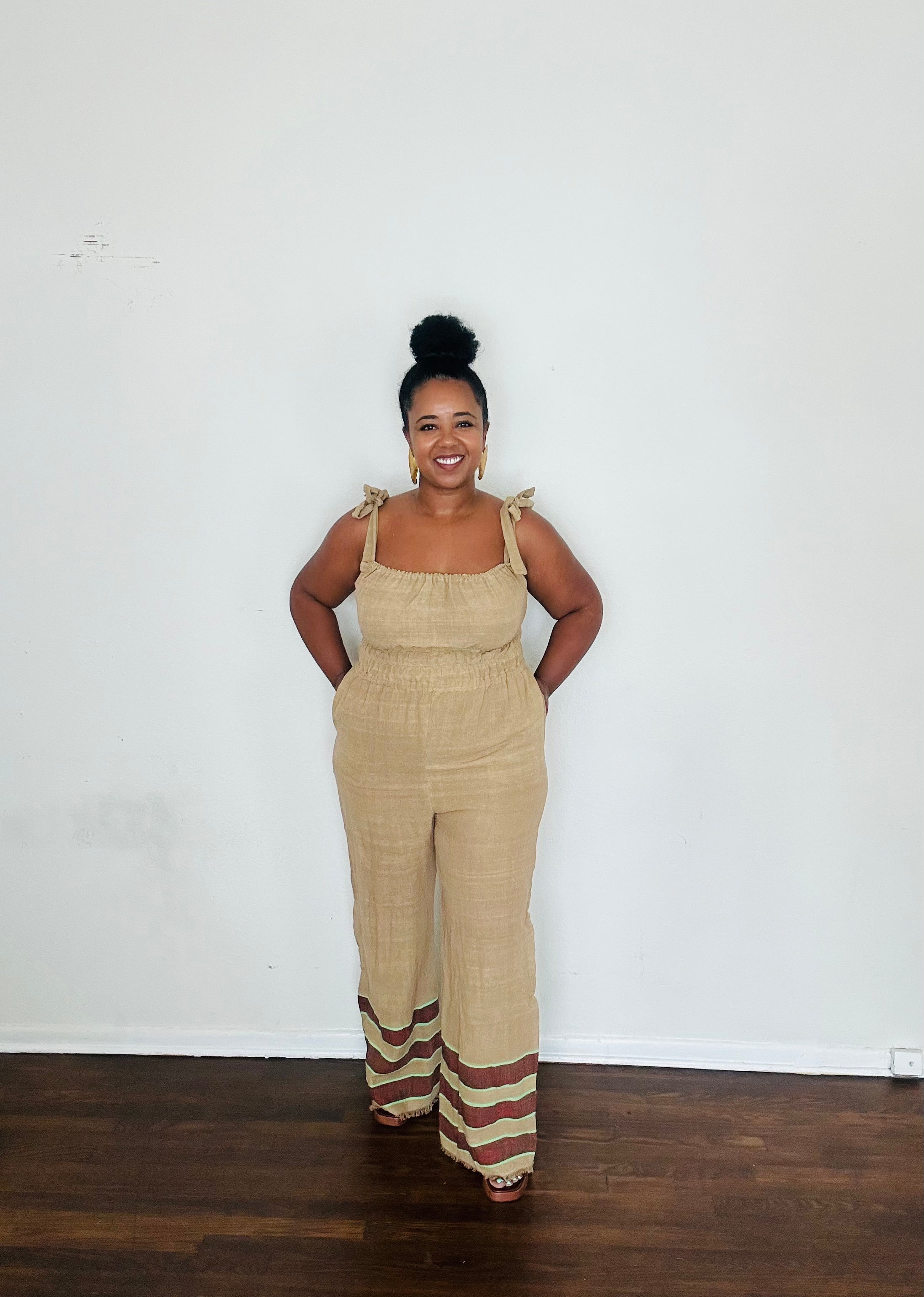 Sebie Jumpsuit in Sahara Clay — handmade 100% cotton khaki jumpsuit with earth-tone hem, versatile for beach-to-city living.