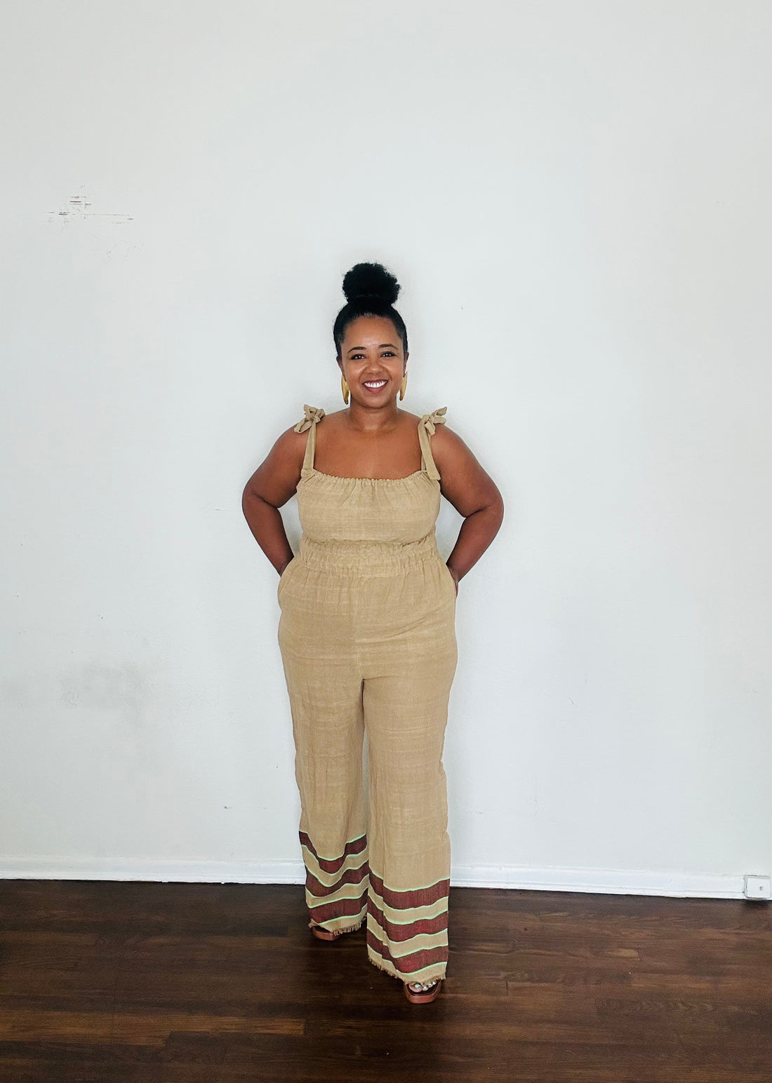Sebie Jumpsuit in Sahara Clay — handmade 100% cotton khaki jumpsuit with earth-tone hem, versatile for beach-to-city living.