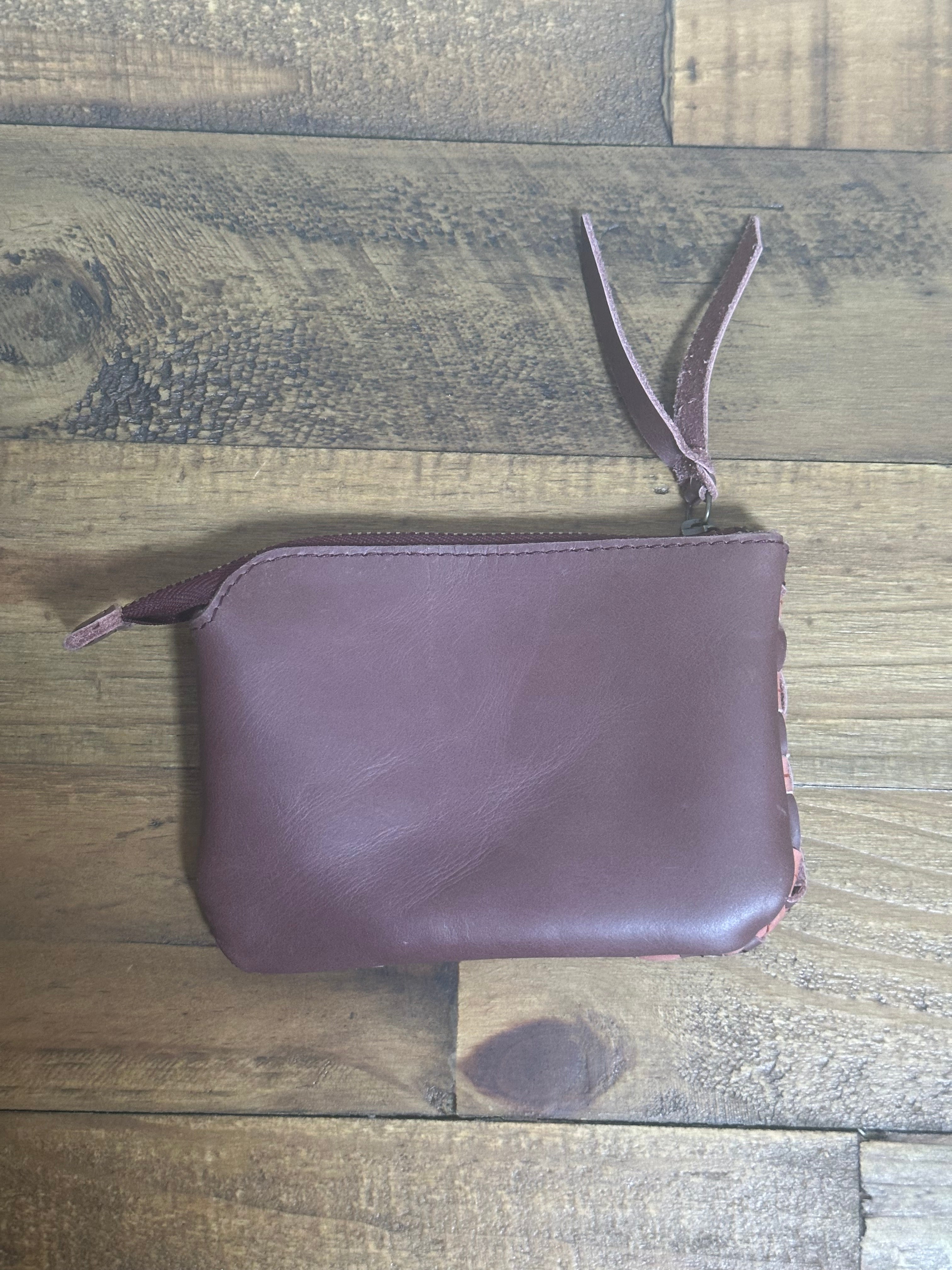 Shashemene Wallet in Garnet Desert Rose — handcrafted Ethiopian leather wallet in plum purple with dusty rose undertones, featuring a smoot backpanel and zipper closure.