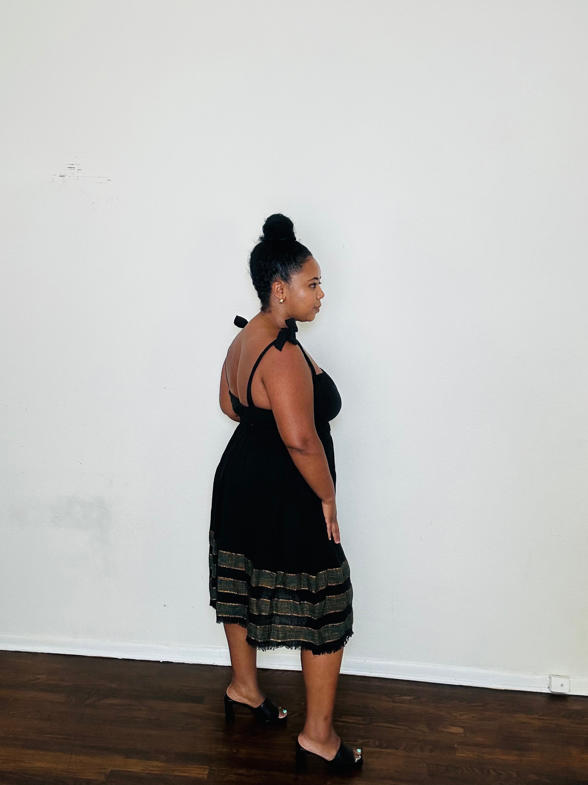 Gelila Dress Obsidian Flow — handmade 100% cotton midi dress with straight neckline, adjustable straps, cinched waist, flowing skirt, and hidden pockets in classic black.