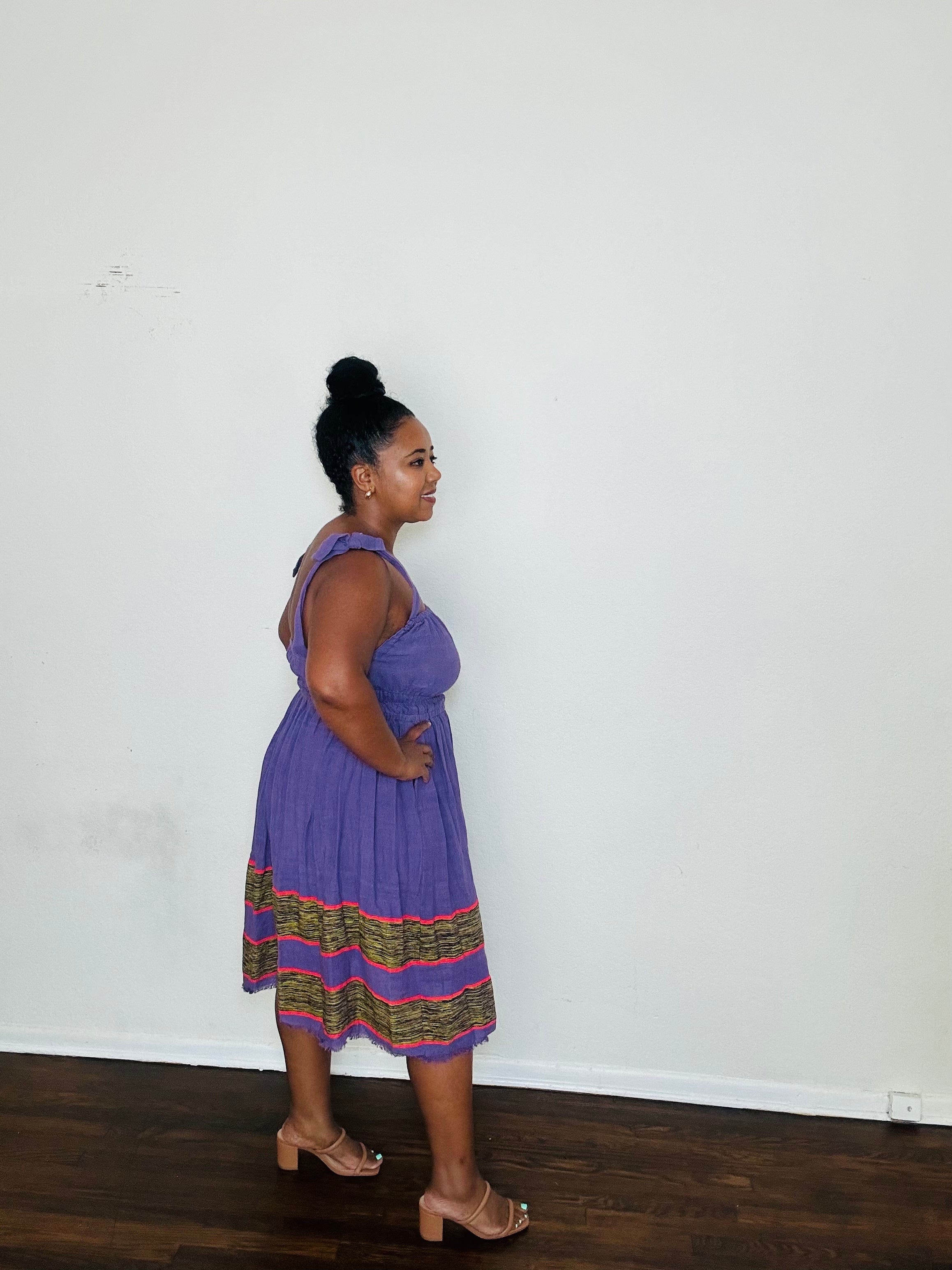 Gelila Dress Twilight Amethyst — handmade 100% cotton midi dress with straight neckline, adjustable straps, cinched waist, flowing skirt, and hidden pockets in a deep purple tone.