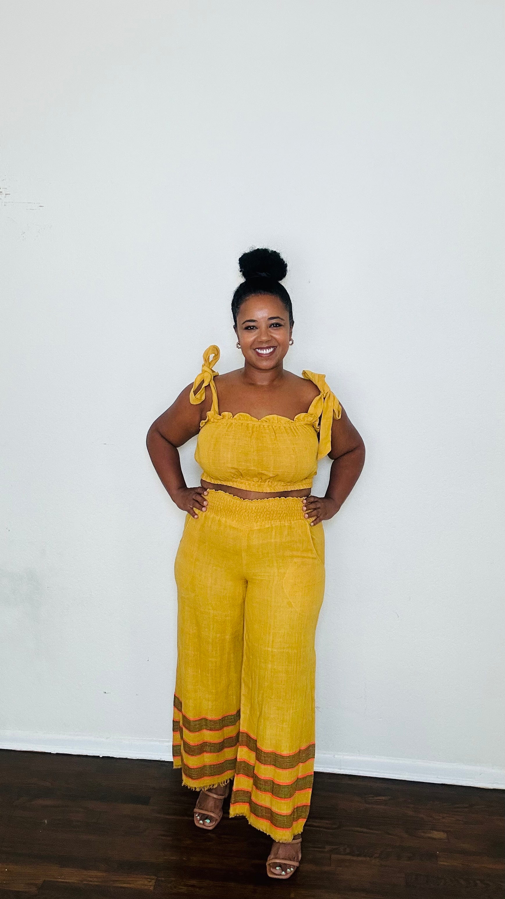 Kidist Pants Ochre Glow — handmade 100% cotton wide-leg trousers with elastic waistband, side pockets, and flowing fit in a rich mustard yellow / golden ochre tone (trending Fall 2025 color).