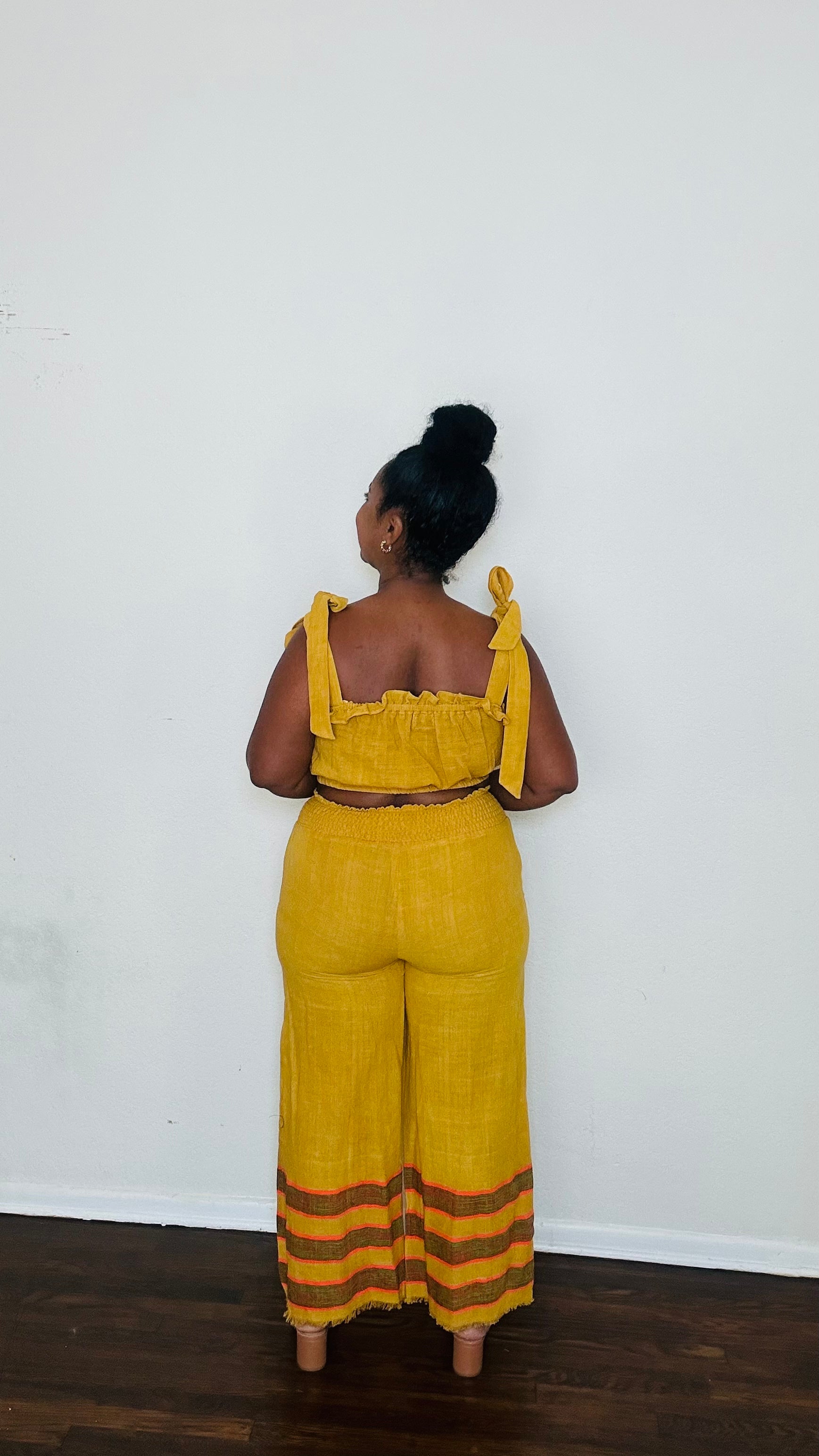 Kidist Pants Ochre Glow — handmade 100% cotton wide-leg trousers with elastic waistband, side pockets, and flowing fit in a rich mustard yellow / golden ochre tone (trending Fall 2025 color).