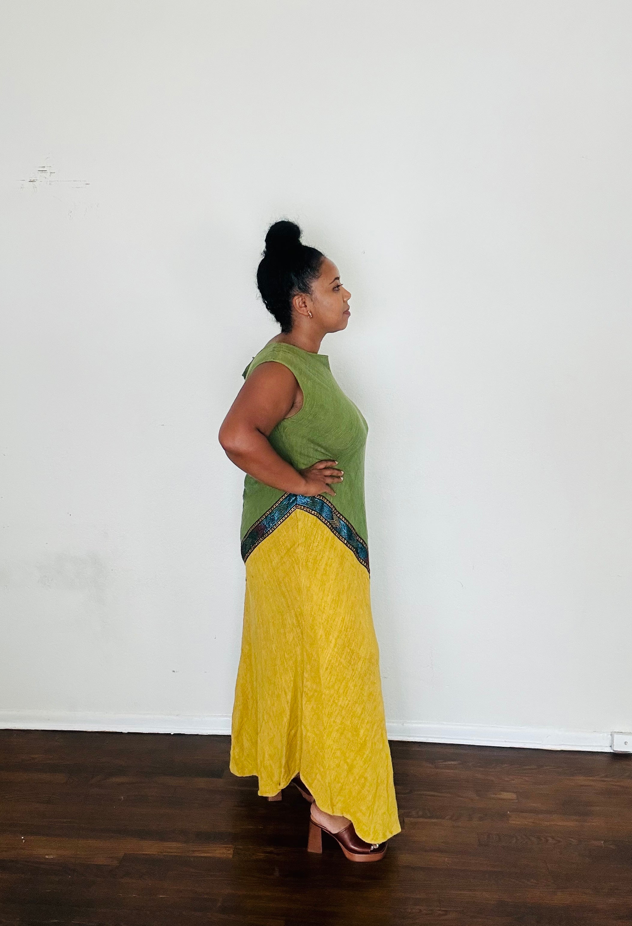 Naomi Dress in Sage Earth — handmade 100% cotton maxi dress with asymmetrical tilet-inspired design in warm yellow-khaki tones, designed to elongate and flatter.