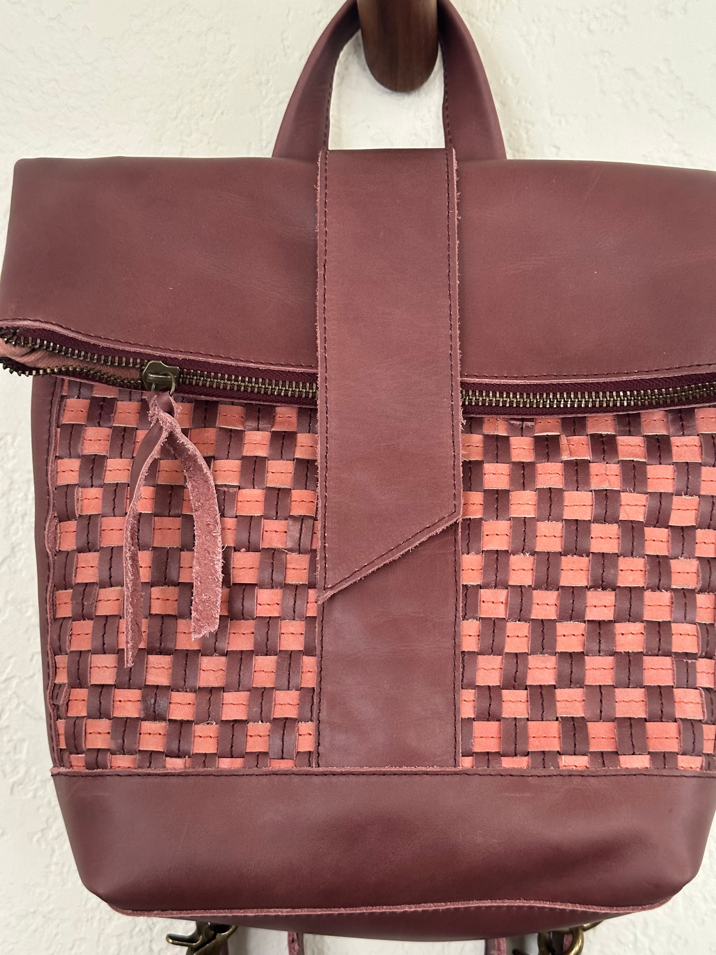 ShopYego Omo Backpack Garnet Desert Rose – compact artisan leather daypack in trending deep wine red with pink checkered accents, handmade in Ethiopia, everyday crossbody style