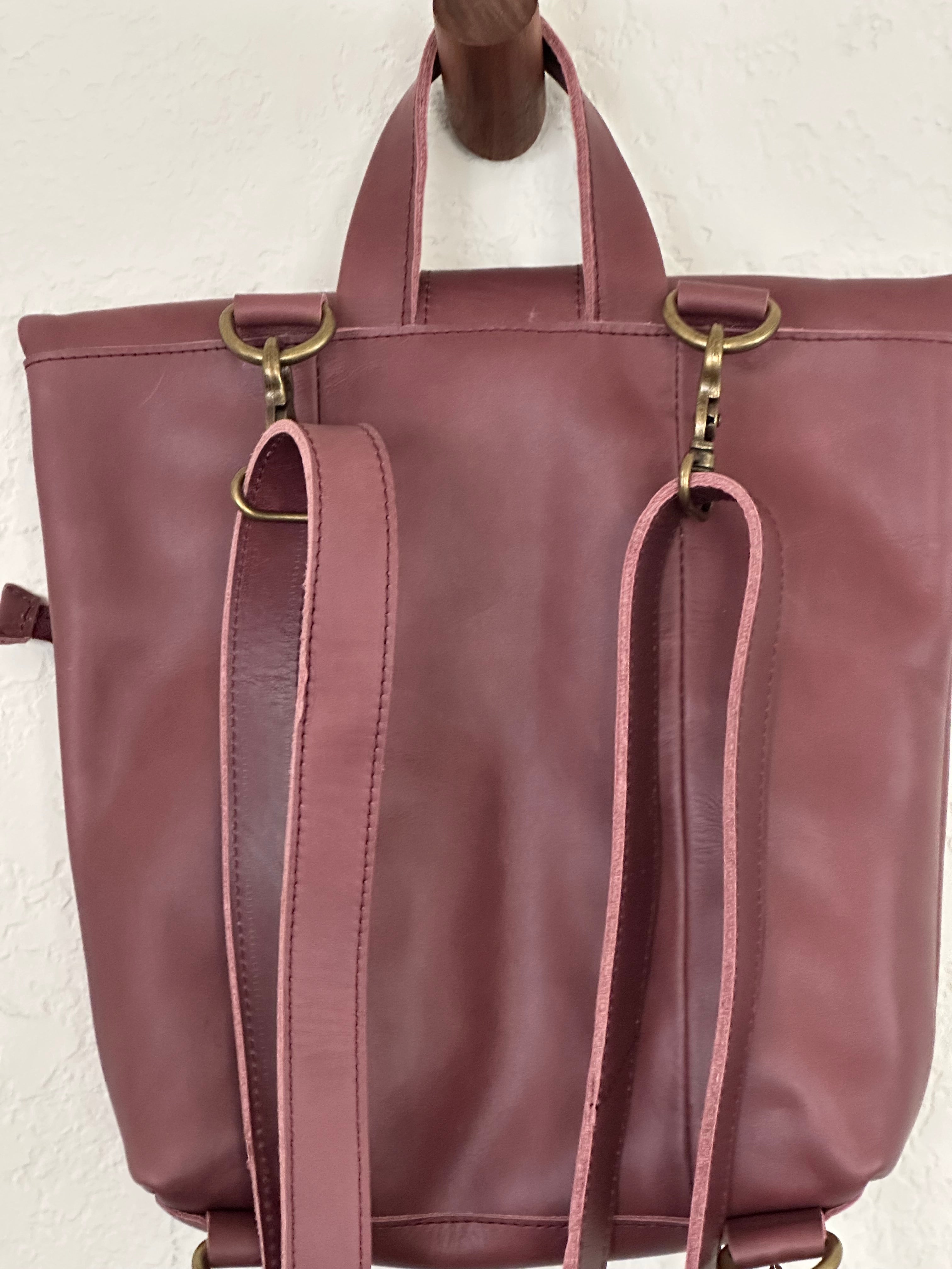 ShopYego Omo Backpack Garnet Desert Rose – compact artisan leather daypack in trending deep wine red with pink checkered accents, handmade in Ethiopia, everyday crossbody style