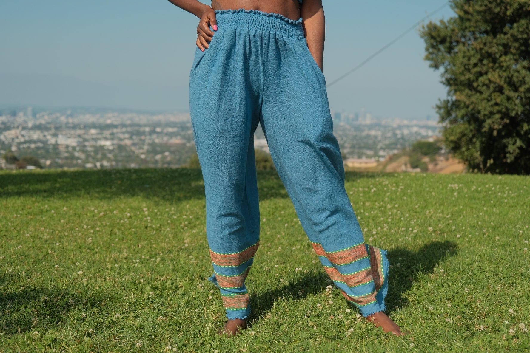 Kidist Pants Azure Blue — handmade 100% cotton wide-leg trousers with elastic waistband, side pockets, and flowing fit