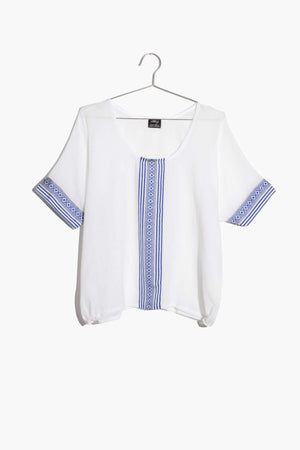 1) The Maya Top is a semi-sheer cotton top with the perfect flowy elegance. The casual round neckline is accented by a beautiful hand-embroidered design down the bodice and on the sleeves. The patterns are reminescent of traditional Habesha Kemis designs and honors the style in a contemporary interpretation